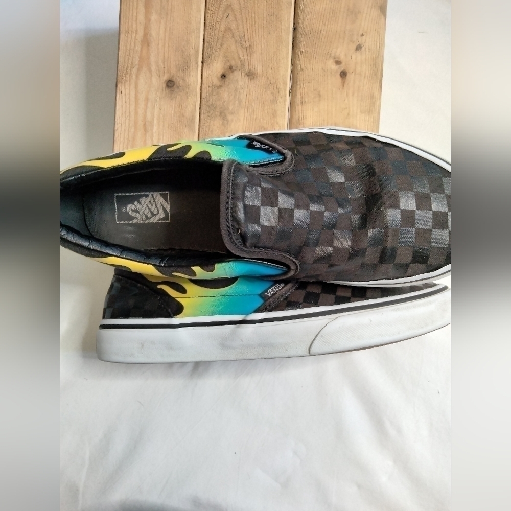 Vans slip on shoe. Size 7. Black with blue/green and yellow🔥 running down side